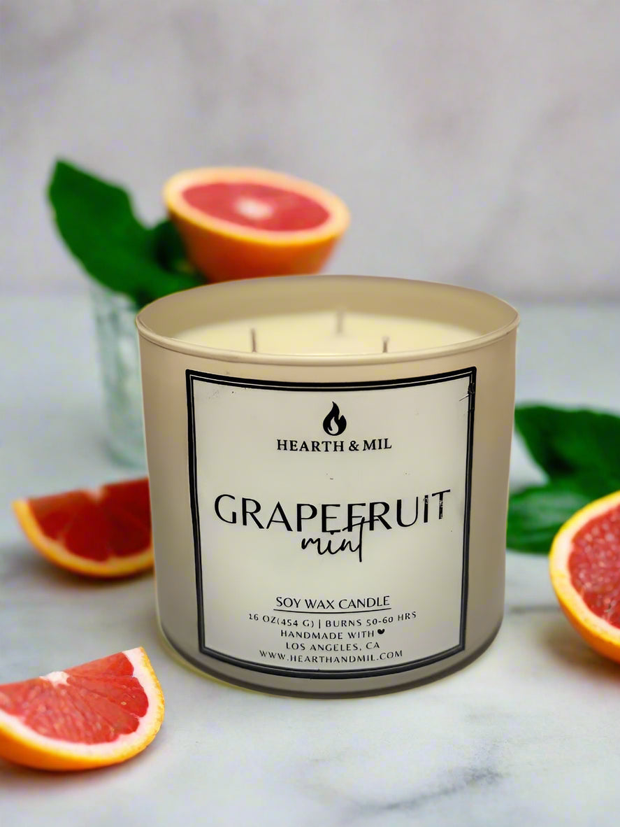 Grapefruit mint candle with 'Hearth & Mil' branding on a light background